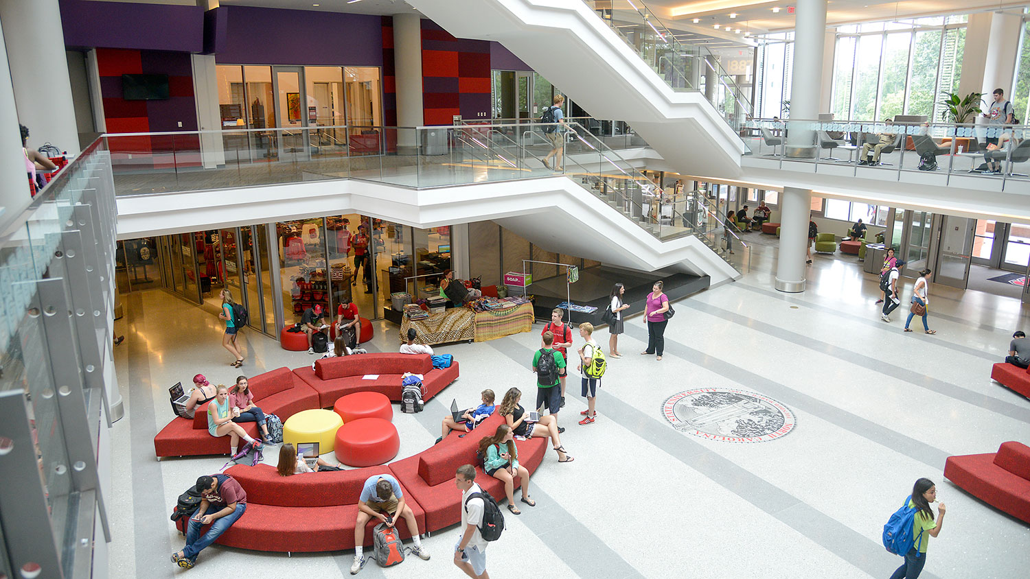 students walking, sitting, and talking in Talley Student Union.