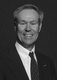 middle aged man smiling in a suit