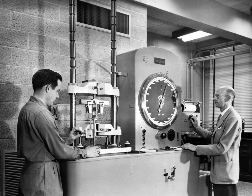 Edward Schoenborn with a student working in the lab