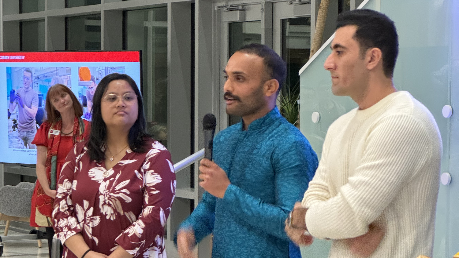 Sara Segerlin, director of the Gregg Museum of Art & Design (far left), looks on as Ph.D. students Hannah Pil, Adarsha Devihalli and Mohammadreza Zare describe their research and their experience working with artist-in-residence Leah Sobsey.