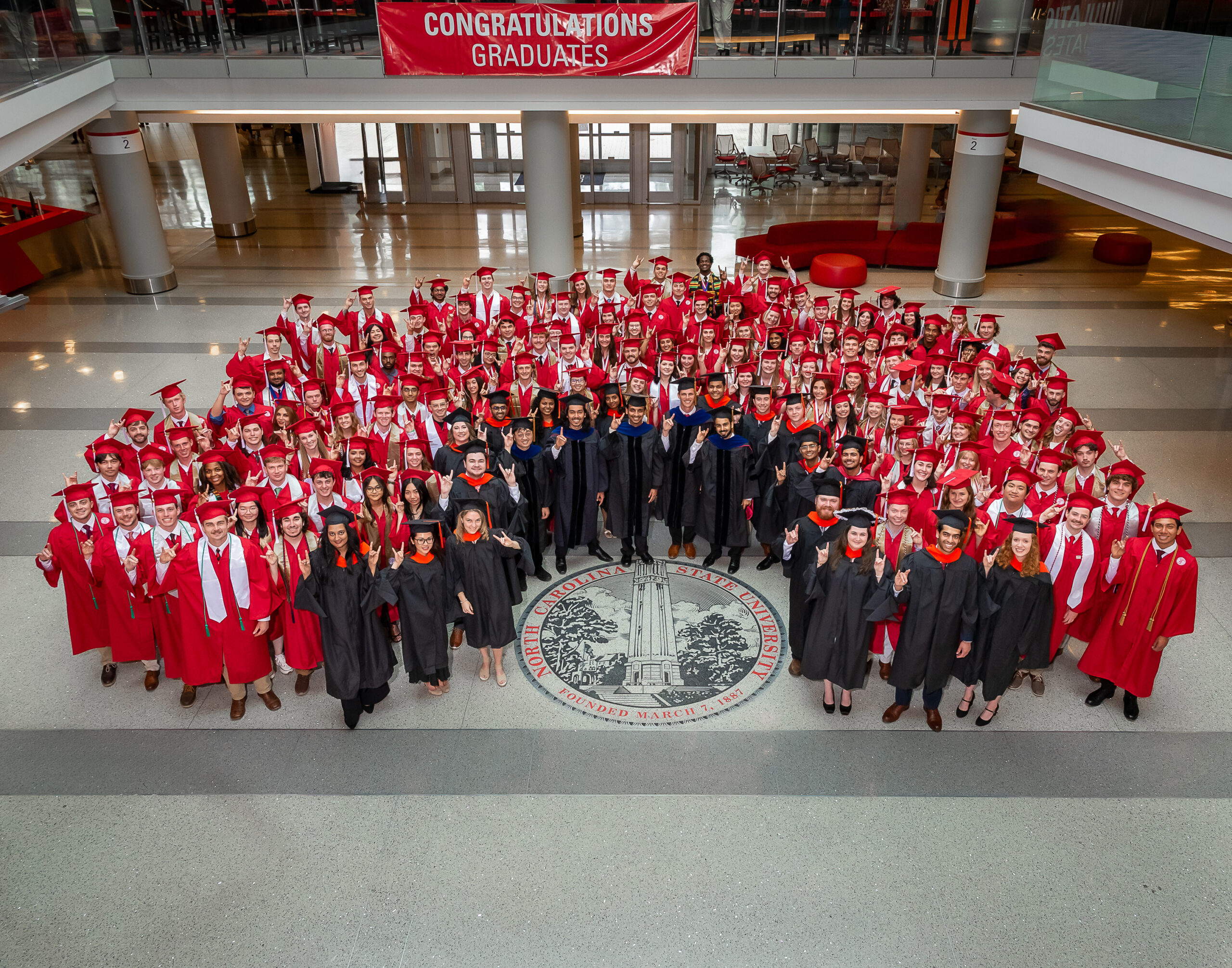 group photo of CBE class of 2026 grads wearing regalia